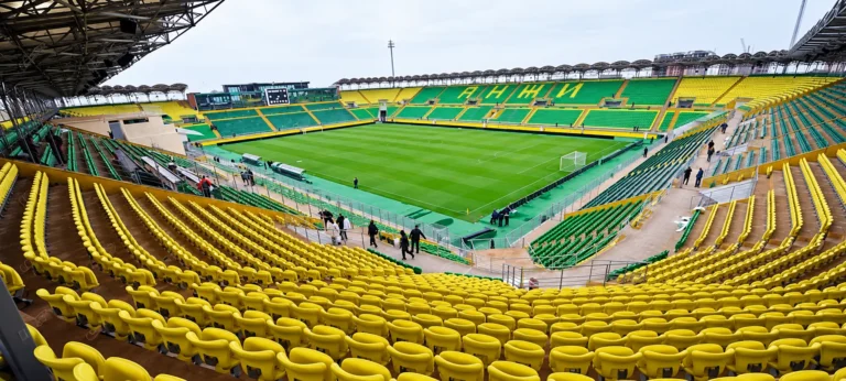 LED screen stadium Anji Arena – Anji Arena seen from the yellow and green stands, display screen on the far stand, empty venue