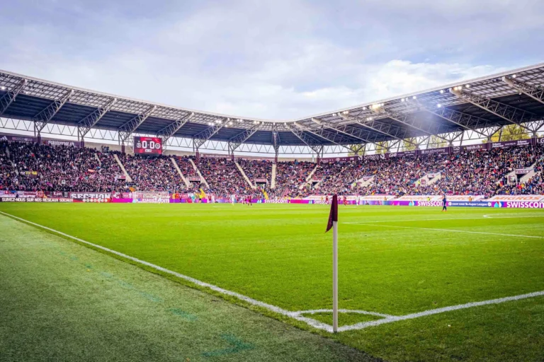 LED screen Swiss football championship – Football match before packed stands, perimeter LED system and scoreboard lit around the pitch