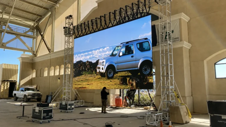 LED display mounted on truss inside a covered riding arena