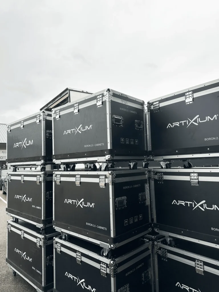 Stack of Artixium flight cases stored outdoors