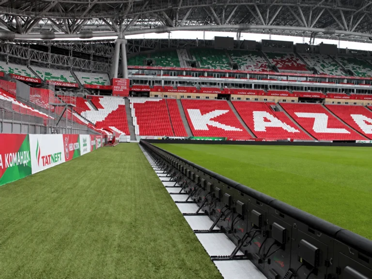 LED screen perimeter stadium Kazan – Rear of the perimeter system LED cabinets at the pitch edge, cabling and support feet visible