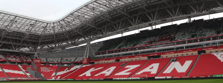 Empty Kazan Arena stands with their seat mosaic, perimeter LED band running along the pitch