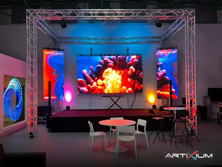 LED video wall on a truss structure showing a colourful explosion above a small stage