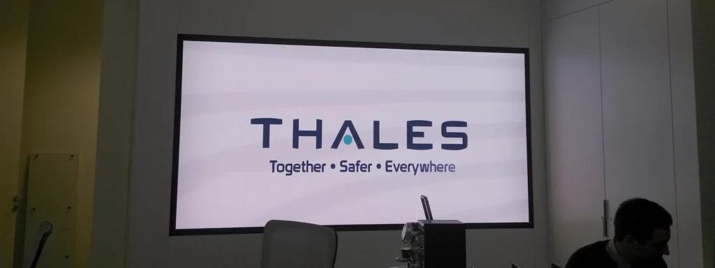 Meeting room LED display showing the Thales logo