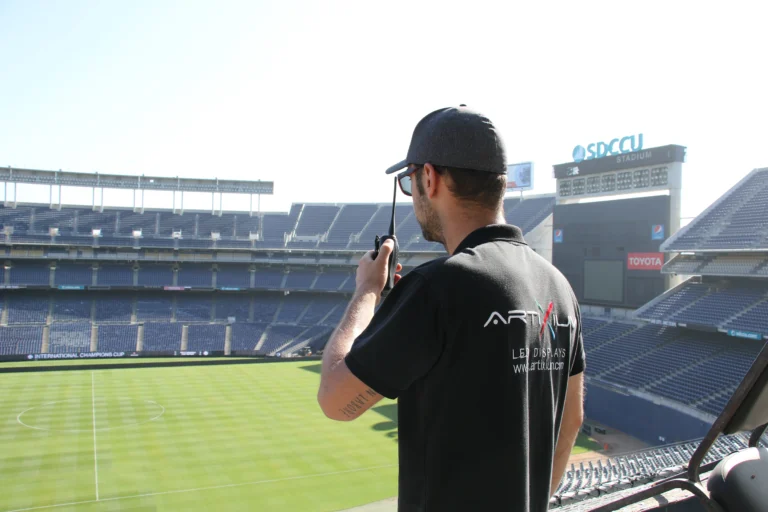 Artixium technician on the radio from the stands, pitch and perimeter system down below