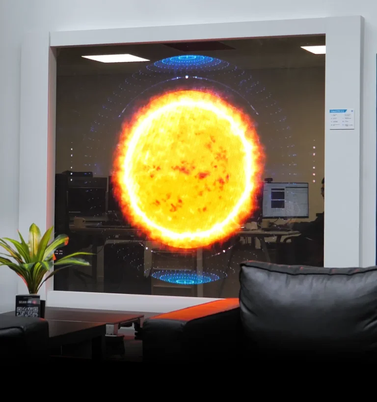 Transparent LED display in a window, with the offices still visible behind the image