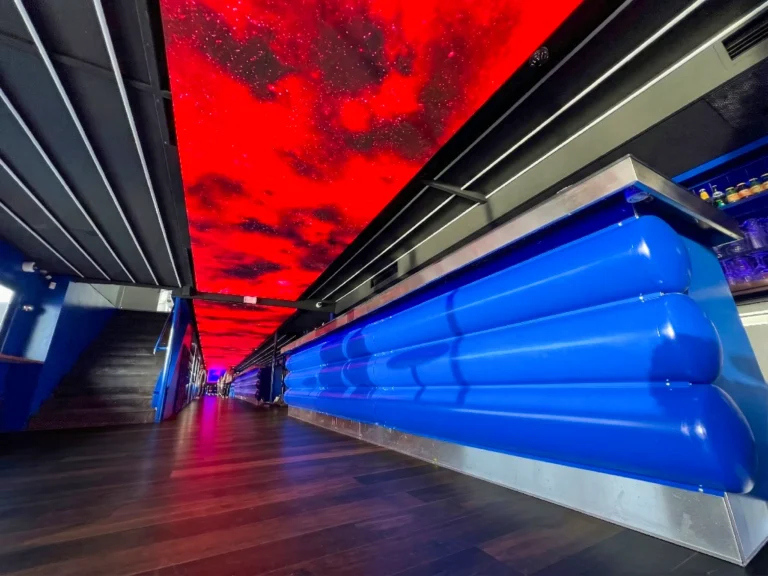 Custom LED ceiling showing a red sky above the bar