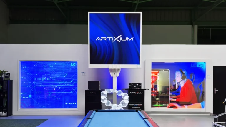 Square LED totem in Artixium colours, flanked by two displays in the showroom