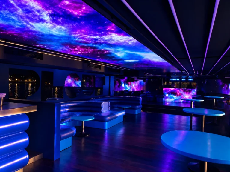 LED screen nightclub – Galaxy visuals on the LED ceiling and walls of the lounge at Le Plouf, DJ booth in the background