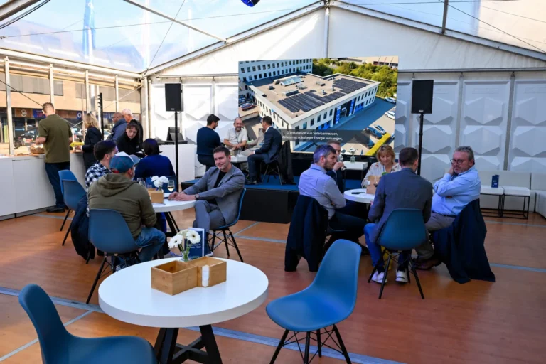 Networking area under the marquee at CK Group’s Tomorrow’s Office 2026 in Luxembourg